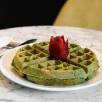 Matcha Waffle · Scratch made waffle infused with matcha and served with a fresh strawberry garnish