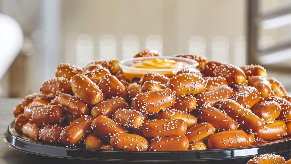 Party Tray -Large Rivet Tray · Pair your Large Size Rivets Party Tray with any 3 of our wide assortment of Pretzel Dips. This tray is prepared with 192 salted rivets. Serves approximately 20-25 guests.