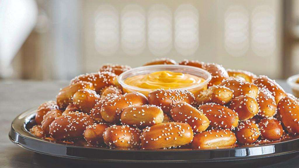 Party Tray -Small Rivet Tray · Pair your Small Size Rivets Party Tray with any 2 of our wide assortment of Pretzel Dips. Prepared with approximately 128 salted rivets. Serves approximately 10-15 guests.