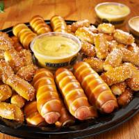 Party Tray -Mini Dogs & Rivets · This tray is served with 36 Mini Cheeseburgers and 64 Rivets plus any 2 of our dips. Serves ...