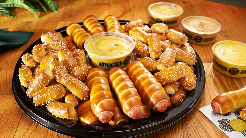 Party Tray -Mini Dogs & Rivets · This tray is served with 36 Mini Cheeseburgers and 64 Rivets plus any 2 of our dips. Serves approximately 20-25 guests.