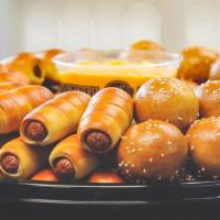 Mini Cheesesteaks & Mini Dogs Party Tray · Can it get any better?! 36 mini cheesesteaks and 36 all beef mini pretzel dogs with american...
