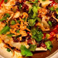 Spicy Dumplings · Homemade dumplings, original spicy sauce, cilantro, scallion, fried onion