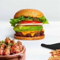Avocado Burger · American beef patty cooked medium and topped with avocado & melted cheese. Served on a brioc...