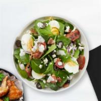 Spinach Salad · Bed of baby spinach with selected toppings.