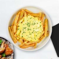 Cheese Fries · Idaho potato fries cooked until golden brown & garnished with salt, garlic, and cheese.