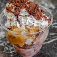 Brownie Bites  · Scoops of Chocolate and Sea Salt Caramel ice cream with warm brownie pieces, whipped cream a...