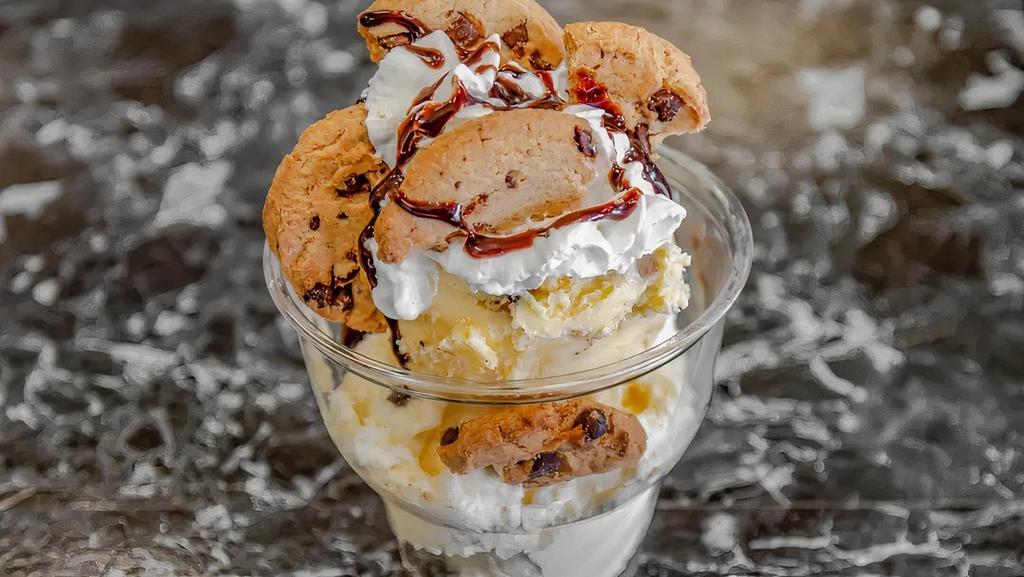 Cookie Lovers  · Scoops of Vanilla and cookie dough ice cream with warm chocolate chip cookie pieces whipped cream and chocolate drizzle