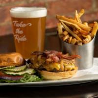 Angus Sirloin Burger · Grilled angus beef, cured applewood bacon, cheddar cheese and sautéed onions on a toasted bu...
