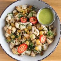 Cauliflower Salad · Nuoc cham, golden raisins, fresh herbs and sesame.