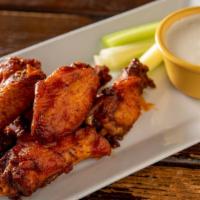 Buffalo Chicken Wings · With blue cheese dressing.