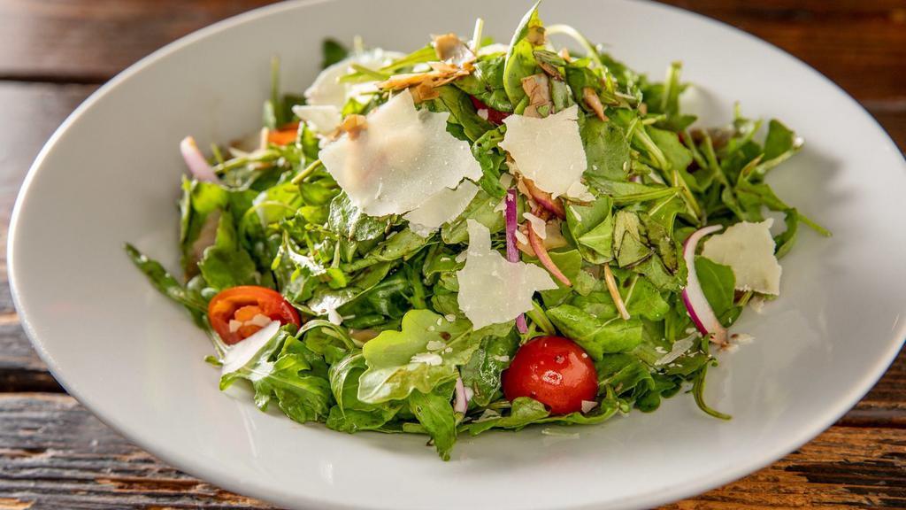 Arugula Salad · Baby arugula with cherry tomatoes, Parmesan cheese, red onions, extra virgin olive oil and balsamic vinegar.