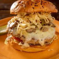 Turkey Burger · Topped with Swiss cheese, Holland-roasted peppers, sauteed mushrooms and crispy onion string...