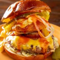 3 Cheese Burger · American, cheddar and smoked mozzarella topped with grilled ham and caramelized onions. Serv...