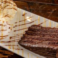 Chocolate Mud Cake With Vanilla Ice Cream · With whipped cream and chocolate sauce.