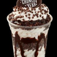 Crunchies Sundae Dasher® · Vanilla soft ice cream with layers of Crunchies and fudge topped with whipped cream and a ch...