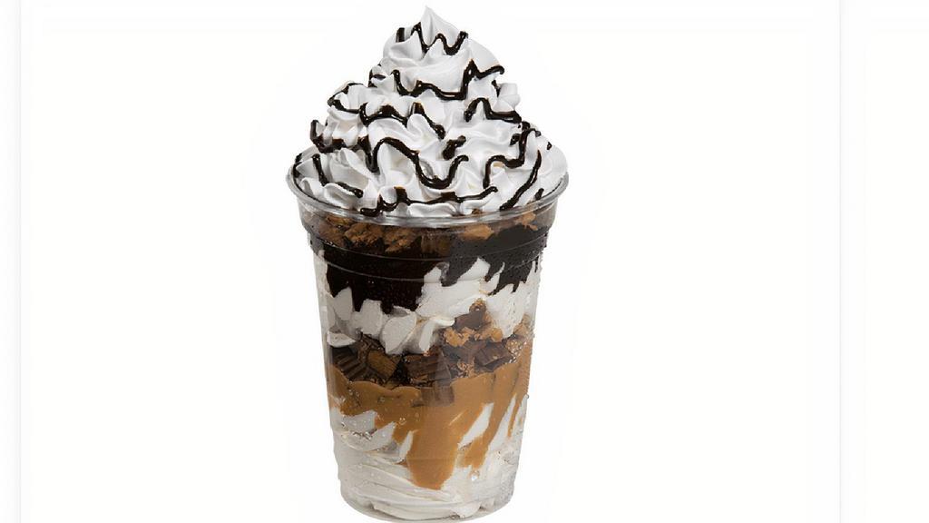 Reese’S ® Peanut Butter Sundae Dasher® · Layers of Reese's® Peanut Butter Cups, Reese's® Peanut Butter sauce, vanilla ice cream, and fudge topped with whipped cream and fudge drizzle.