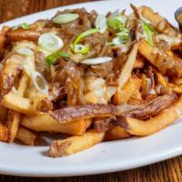 Deluxe Curry Fries · Caramelized onion, Toasted Spice Curry Suace, white Cheddar, chive.