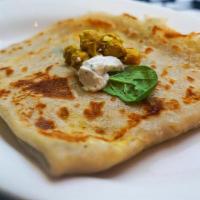 Coconut Curry Chickpea Crepe (Vegan) · A customer favorite! Coconut curry chickpeas, onion confit, and fresh spinach.