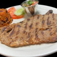 8) Carne Asada Con Chimol / 8) Broiled Steak With Chopped Tomatoes · 