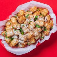 Garlic Parm Tots · Grated potato puffs tossed in our signature Garlic Parm dry rub! 280-640 cal.
