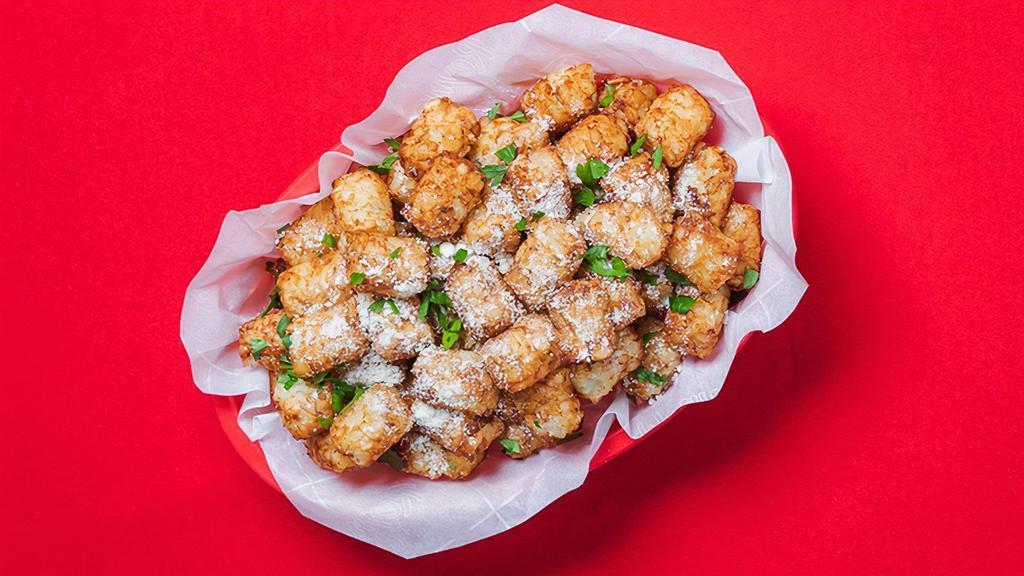 Garlic Parm Tots (Tray) · Party tray of our grated potato puffs tossed in our signature Garlic Parm dry rub! 2,240-2,560 cal.