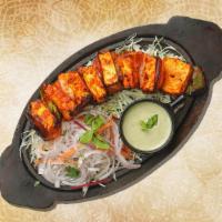 Char Grilled Cottage Cheese Tikka · Cubes of cheese marinated with yogurt and spices grilled in tandoor and grilled in a traditi...