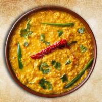 Yellow Dal Tadka · Lentils slow cooked and finished with a traditional tempering of herbs and spices