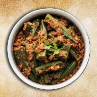Curried Okra Masala · Fresh diced okra sauteed with red onion, tomato, coriander tempered with Indian spices