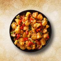 Cauliflower & Potato Curry · Cauliflower and potatoes cooked with onions, ginger, garlic and seasoned with Indian herbs a...