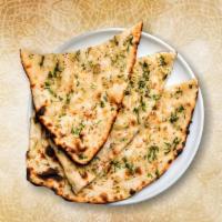 Garlic Blast Naan · Fresh made leavened dough loaded with fine chopped garlic and baked in a traditional coal ov...