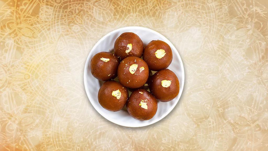 Classic Gulab Jamun  · Deep-fried dumplings soaked in a spiced sugar syrup