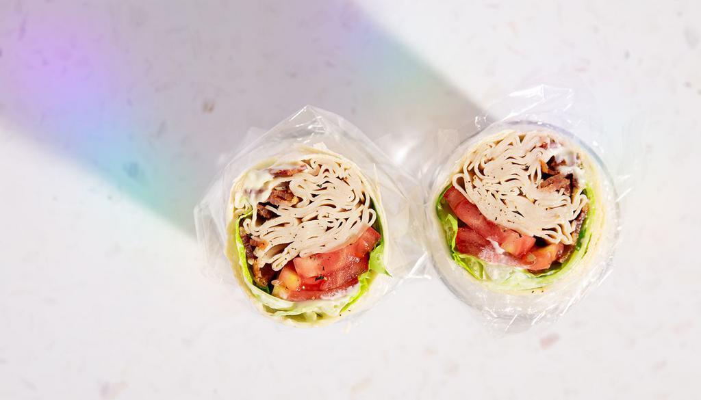 Turkey Club Wrap · Turkey, Bacon, Lettuce, Tomato, Mayo, Flour Wrap