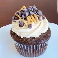 Charlie Brown · Chocolate cake, topped with peanut butter buttercream, drizzled with chocolate ganache, pean...