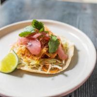 Chicken Tinga · Gluten free. Flame grilled chicken thigh, tinga sauce, grapefruit pickled onion, lime slaw.