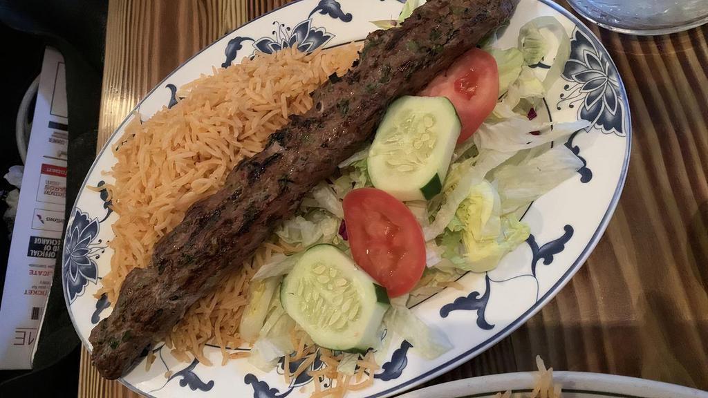 Lamb Kofta Kebab · Ground lamb marinated in fresh grated spices, broiled over wood charcoal.
