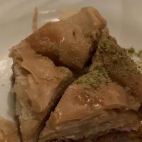Baklava · Homemade sweet slice with almonds and pistachio nuts.