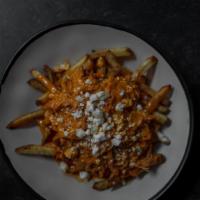 Buffalo Fries · Pulled Buffalo Chicken topped with Buff Blue sauce and blue cheese crumbles.