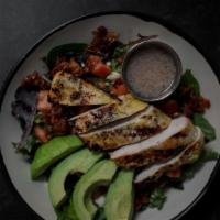Cobb Salad · Seasonal Greens, grilled honey garlic chicken, candied bacon, hard boiled egg, tomato, crumb...