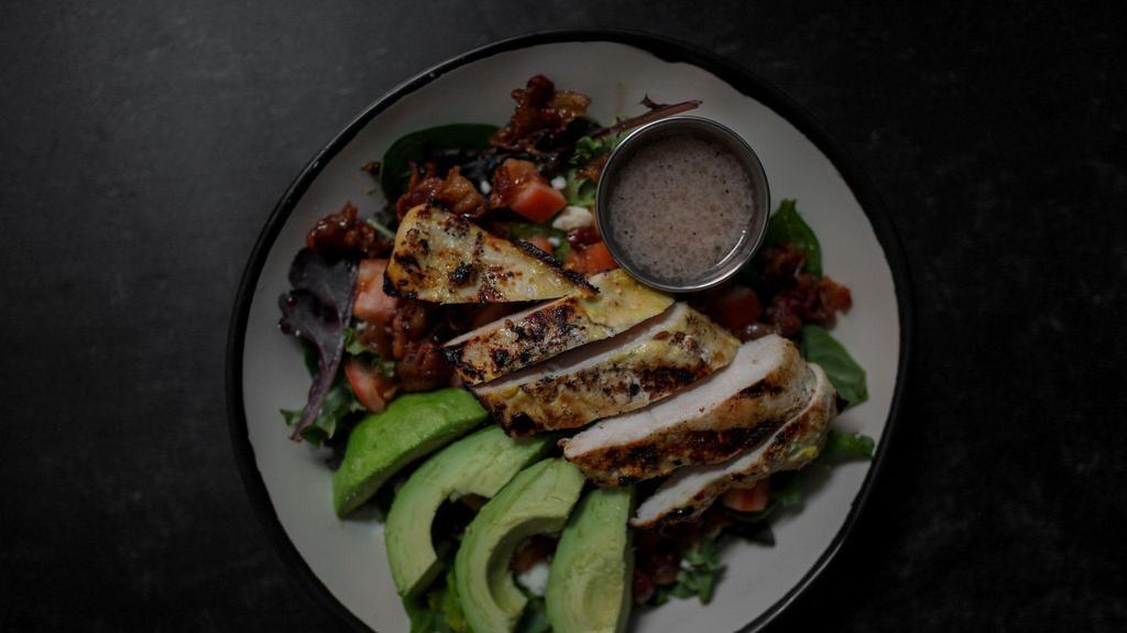 Cobb Salad · Seasonal Greens, grilled honey garlic chicken, candied bacon, hard boiled egg, tomato, crumbly bleu cheese, avocado, side of honey apple cider vin