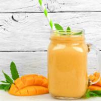 Mango Blast Smoothie · Mad delicious mango smoothie with strawberries and banana.