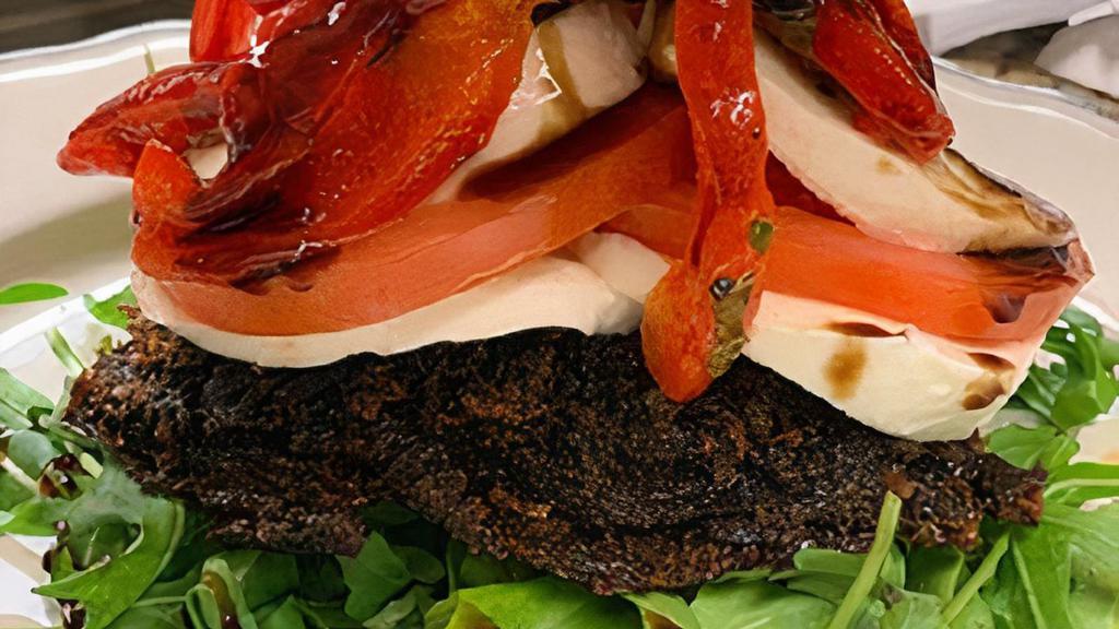 Portobello Napoleon · Oven Roasted Sweet Red Peppers, Fresh Mozzarella, Portobello Mushrooms Topped w/Melted Swiss, Finished in a Balsamic Reduction.