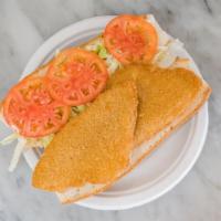 Fish Filet Sandwich · Lightly breaded cod fish with melted american cheese, lettuce, tomato and tarter sauce on a ...