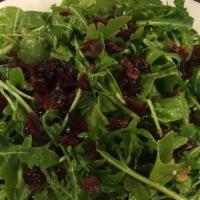 Arugula Salad · Dried cranberries, walnuts, and blue cheese in a homemade lemon vinaigrette dressing. Add gr...