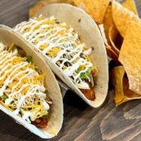 Tacos (2) · Includes two with chips. Add 3rd taco for 3.99.