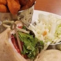 Turkey And Brie Wrap · Oven-roasted turkey, creamy brie cheese, baby greens, roasted peppers and a cranberry orange...