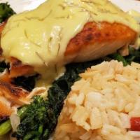 Towne Hall Salmon · Served on a bed of broccoli rabe with white beans topped with diced tomatoes in a rosemary l...