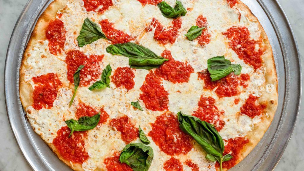 Margherita Pizza · Fresh mozzarella, basil, and tomatoes.