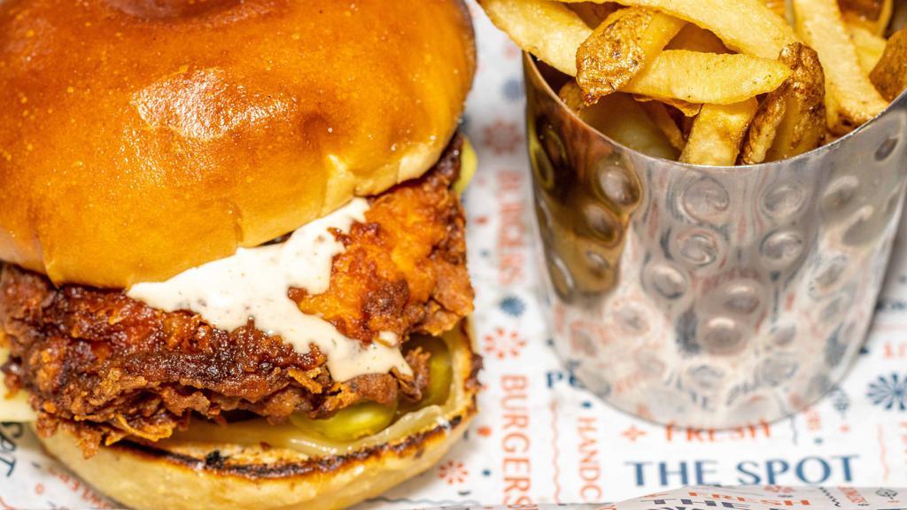 Dirty Bird · Buttermilk-fried chicken breast, pickled jalapenos, dill pickles, cheddar cheese, & chipotle ranch dressing.