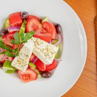 Traditional Greek · New Jersey tomatoes, feta, cucumbers, red onions, peppers and olives.